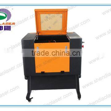 Low Price multi-function Crystal,Wood, MDF, Glass, Crystal, Marble, Stone Laser engraving machine with Rotary device