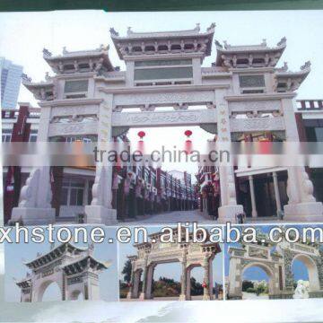 huge stone decorated archway gate with dragon carvings