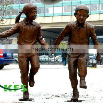 Bronze boy and girl running sculpture