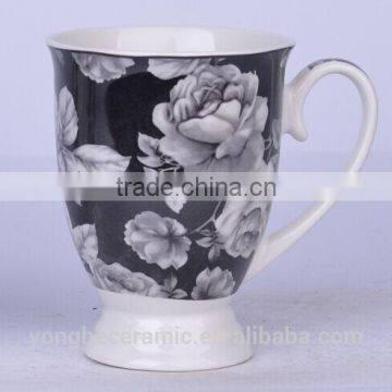 Black and white footed coffee mugs