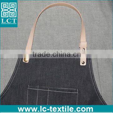 black denim apron with leather straps