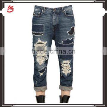 Wholesale jeans pants price shinny broken tore up jeans for man