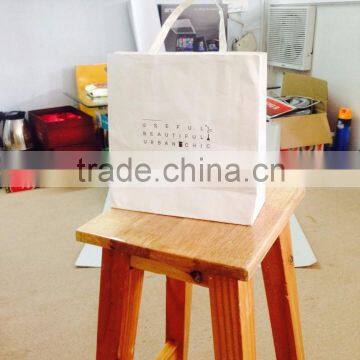 white paper bag with black text printing