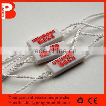 2015 hot Custom embossed plastic seal tags for different garment hang tags