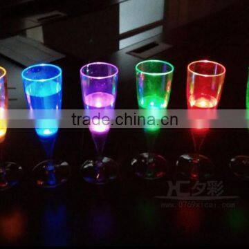 LED flashing a champagne celebration/wedding party/bar/plastic glass