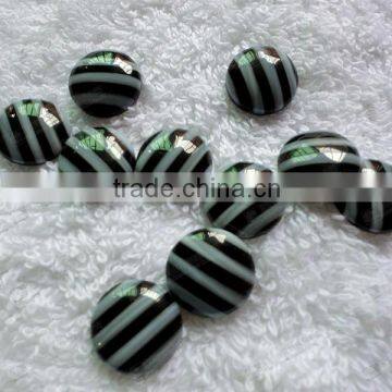 Mother of pearl and black onyx mosaic round cabochon