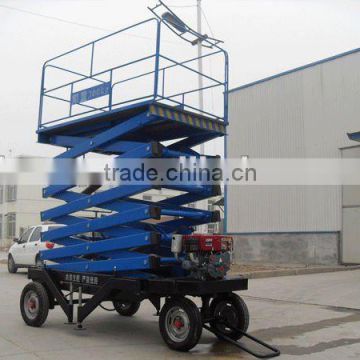 Trailing scissor lift table