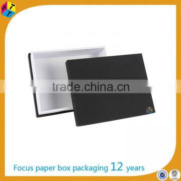 Black high quality cardboard box packing a shirt