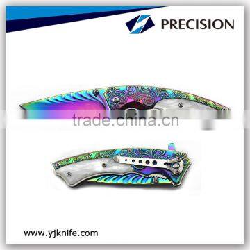 Fancy titanium coated folding collection knife with Carve patterns handle