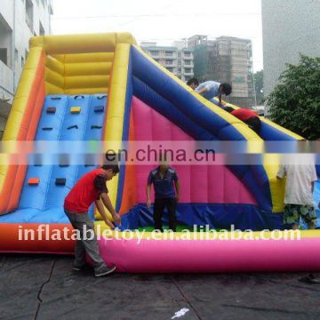 Inflatable castle slide with pool