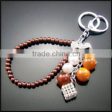 Factory price grape fruit bobbles, pompon,rhinestone magic cube metal keychain