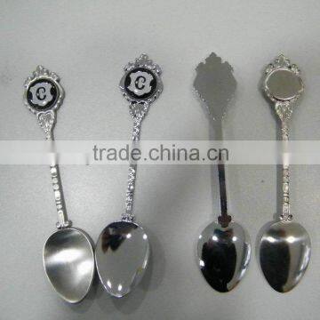 Stainless steel tea spoon with epoxy sticker logo