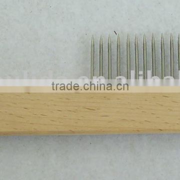 Painting tool cleaning brush with sharp pins