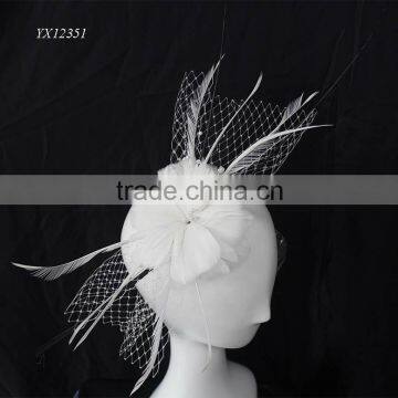 White feather fascinator with black ostrich quill on clip