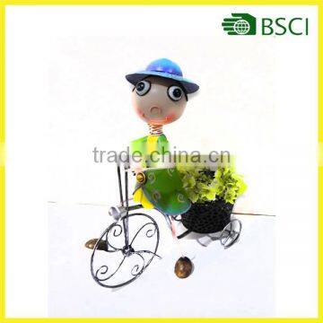 Colorful metal garden boy with bicycle for garden ornament