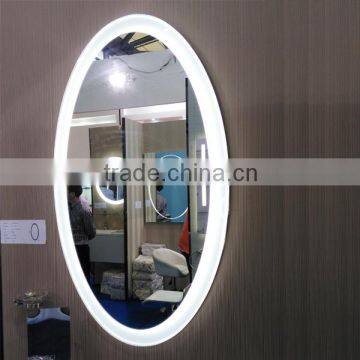 Oval lighted cosmetic mirror with defogger