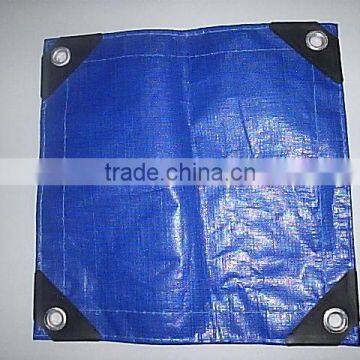 blue-white tarpaulin with rope and grommets