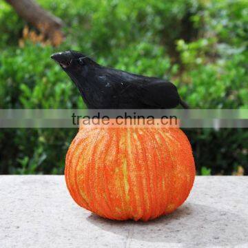 Hallween polyfoam pumpkin with small feather crow decor