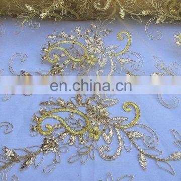 Golden elegant embroidered sequined floral fabric