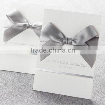 Elegant & Romantic White Pocket Fold Wedding Invitation With Silver Bow & Silver Border photo-1