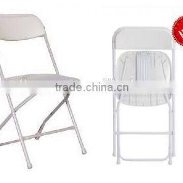 white metal and plastic folding chair