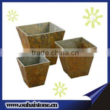 Green plants flowers pots yellow rusty slate natural stone planters