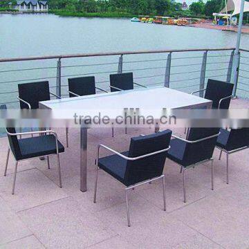 Stainless steel and Rattan Dining tables and chairs for sale