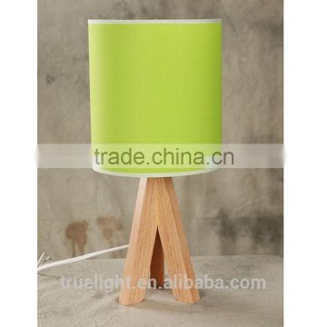 a table lamp with wood and fabric for hotel home decor from china