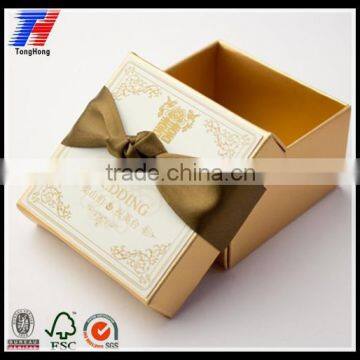 Wedding gold paper box for gift packaging with ribbon