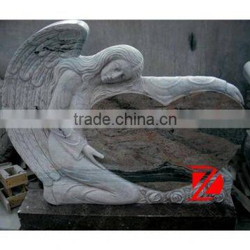 heart shaped headstone with angel sculpture