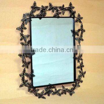 Metal wall mirror with butterfly