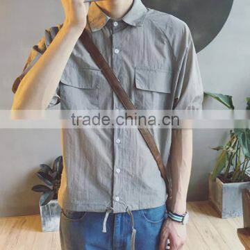 Loosely contracted pocket short sleeve shirt