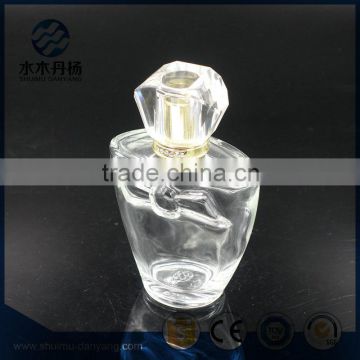 Hot sale 100ml clear glass perfume bottle with fancy cap