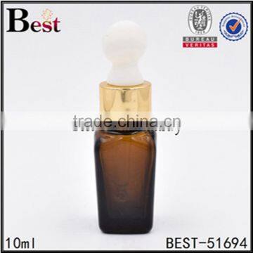 10ml round shoulder pharmaceutical amber glass serum bottle with gold color dropper                        
                                                                                Supplier's Choice