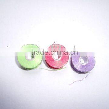 Sideless sideless prewound bobbin thread