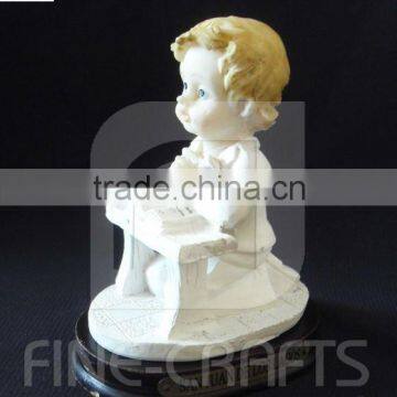 Resin kneeling position boy religious sculpture