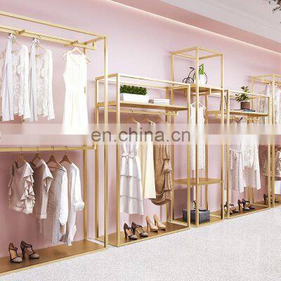 Custom luxury wall display  gold cloth Noble rack for clothing stores