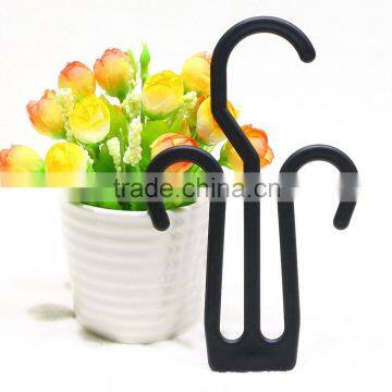 black plastic shoe hook