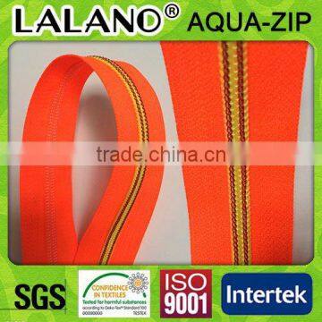 Custom zipper with yellow teeth and orange tape