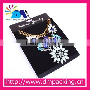 black plastic necklace hanging card display jewelry