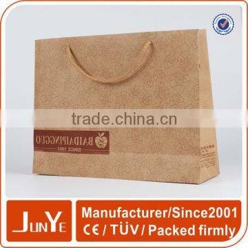 Plain recycled brown paper shopping bags in different size with handles