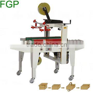 FXJ-5050 top & bottom drive paper carton automatic adhesive tape sealing machine