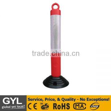 red and white plastic fence sign post