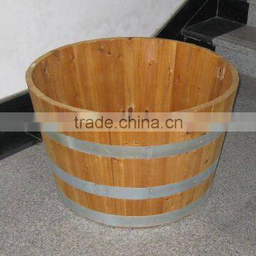 round wooden flower planter with hoop iron