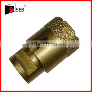 Vacuum brazed reinforced diamond core drill bits