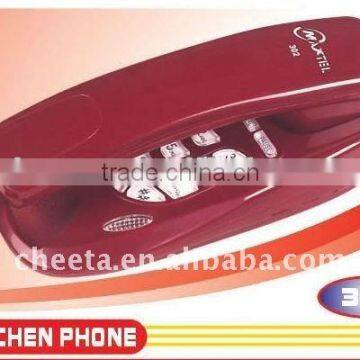 Red bathroom wall hanging corded slim telephone