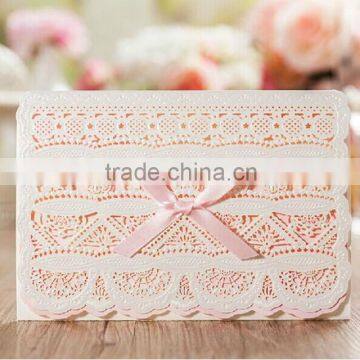 Hot sale white laser cut wedding invitations with pink inserts & pink ribbons