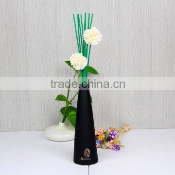 Pastoral style of black ceramic fragrant cane reed diffuser with green rattan sticks