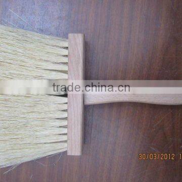 Wall brush with wooden handle