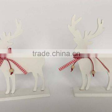 Wooden christmas decoration reindeer on topdesk